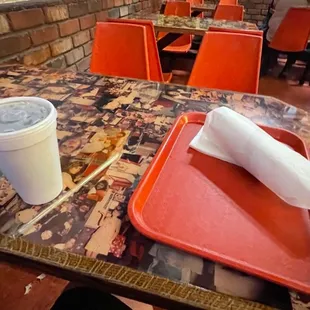 a tray of food and a drink on a table