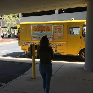 An individual demonstrates a swift approach to Captain Cookie and the Milk Man Food Truck.