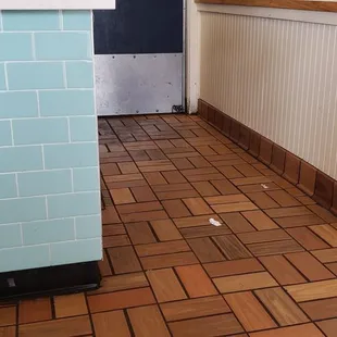 old food on the walls and caked up in the corners of the floor.