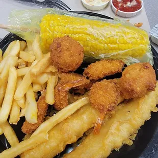 a plate of fried fish and fries