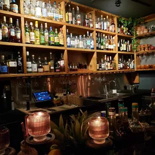 a bar filled with bottles of alcohol
