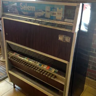 OMG they have a vintage cigarette machine!! I have not seen one of these in YEARS