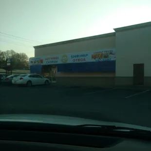 a car parked in front of a store