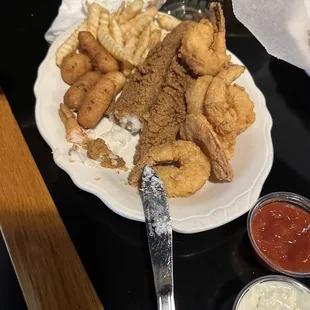 Catfish, shrimp, amazing hush puppies (I&apos;m not a hush puppy fan) and French fries.