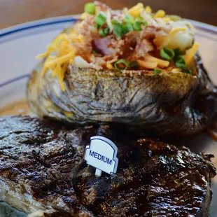Medium steak and loaded baked potato