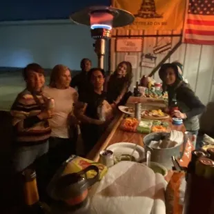 a group of people sitting at a bar