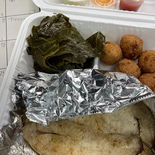 Broiled tilapia, greens, and hush puppies