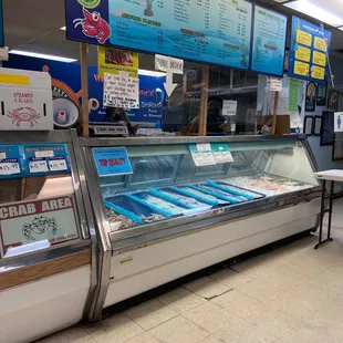 The cooler with fish &amp; shrimp on ice. Crabs on the side. Right now you can't sit inside. They are nice, polite and helpful.