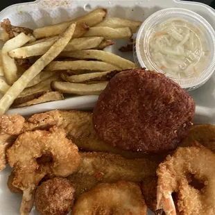 Seafood Platter: 4 Shrimps, 2 pieces of Whiting, 1 Fried Crab Cake, Hush Puppies, French Fries &amp; Cole Slaw...