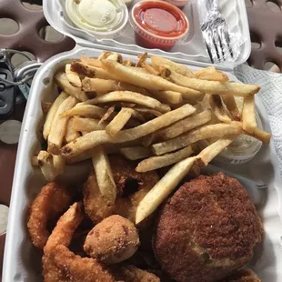 shrimp, crab cake, sea trout with fries, slaw and hush puppies