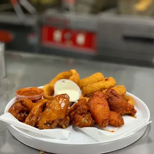 Buffalo and Honey bbq party wings with onion rings and ranch