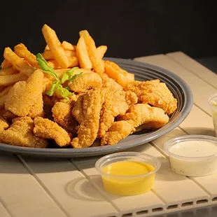 a plate of fried fish and fries