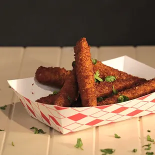 a basket of fried fish sticks