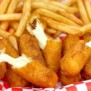 a basket of fried fish and fries