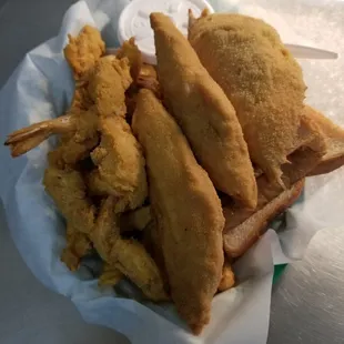Captain&apos;s seafood platter includes 2 fish, 5 shrimp,  stuffed crab,  fries, slaw.