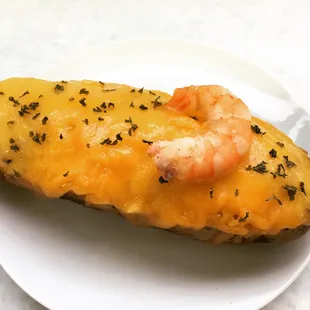shrimp and cheese on a piece of bread