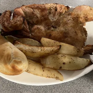 Thursday night special - 1/2 Greek chicken with seasoned potatoes and dinner roll.