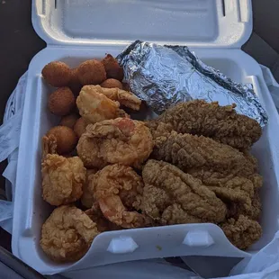 Fired jumbo shrimp and s&amp;p catfish strips, baked potato and hush puppies.