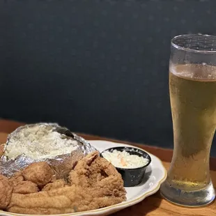 a plate of fried chicken and a glass of beer