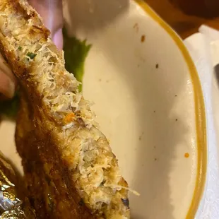 Crab cake with many fillers.