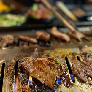 a closeup of a steak on a grill