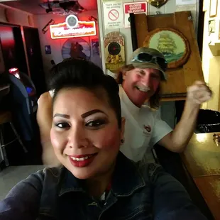 a man and a woman sitting at a bar