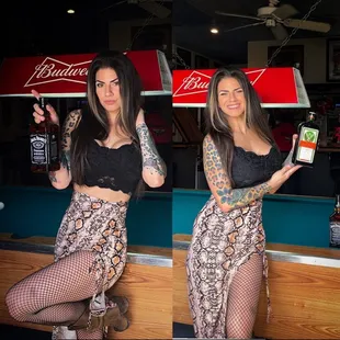 a woman holding a bottle of beer