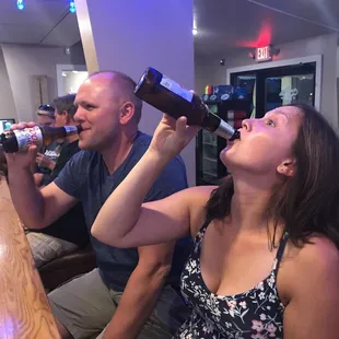 a man and a woman drinking beer