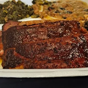Two Meat Combo with ribs, brisket, smoked beans, collared greens and corn bread | Everything was great, wasn't a fan of the greens.
