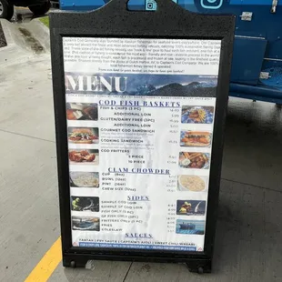 a menu on a sidewalk