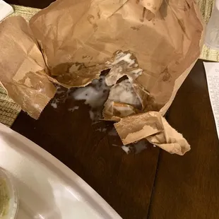 a donut in a paper bag