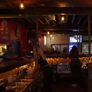 Bartenders serving customers