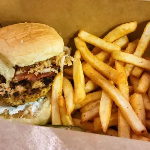 "Texan Crab Cake Sandwich" (w/ jalapeño cream cheese, bacon, and onion crisps) and Old Bay seasoned fries.