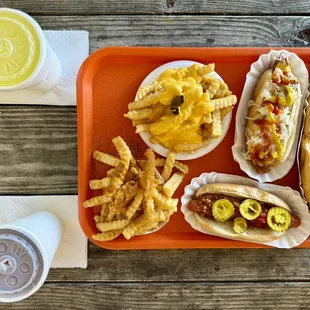 a tray of hotdogs and french fries