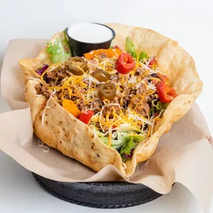 a taco salad in a basket