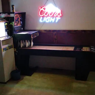 a neon sign in the corner of a room