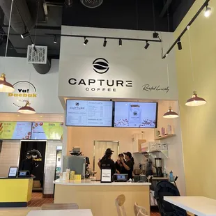 Capture Coffee. Only can pick up at the counter after ordering through kiosk for soft opening purposes at this time.