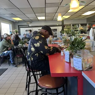 a man sitting at the counter