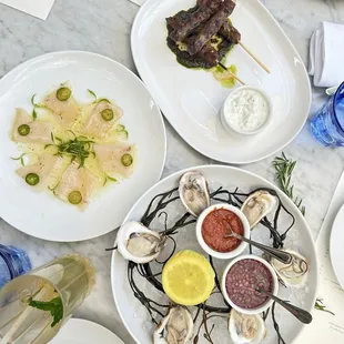 Yellowtail Crudo, Lamb Skewers, 1/2 lb. Oysters