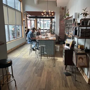 two people sitting at a table in a coffee shop