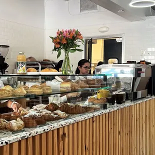 a counter with a variety of baked goods