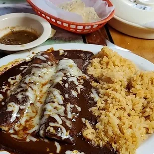 Friday special.   Chicken mole enchiladas plate with double rice and tea.