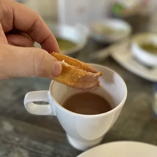 Churros dipped in hot chocolate