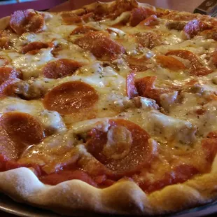 Cheese, Sausage, Pepperoni on thin, cracker crust