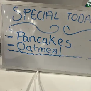 a whiteboard with a sign that says special tony pancakes oatmeal