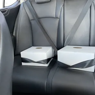 two boxes in the back of a car