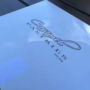 a pizza box on a picnic table