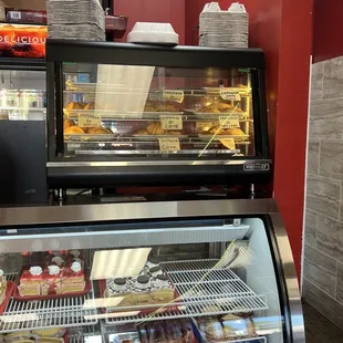 a deli case filled with donuts