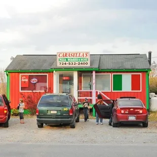 cars parked in front of the restaurant