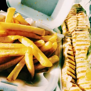 Falafel Sandwich with pickled turnips, Persian pickles, house tahini sauce.